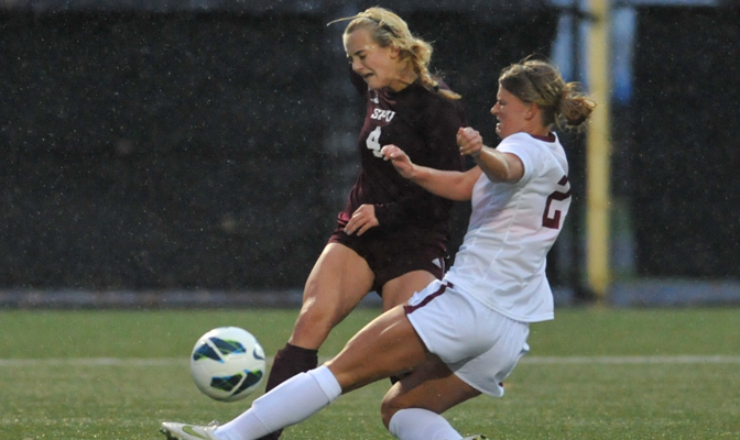 Seattle Pacific's Taylor Hauck (4) played all 90 minutes on Thursday as her team battled through the rain and a fiercely competitive Central Washington team to a 2-1 victory.